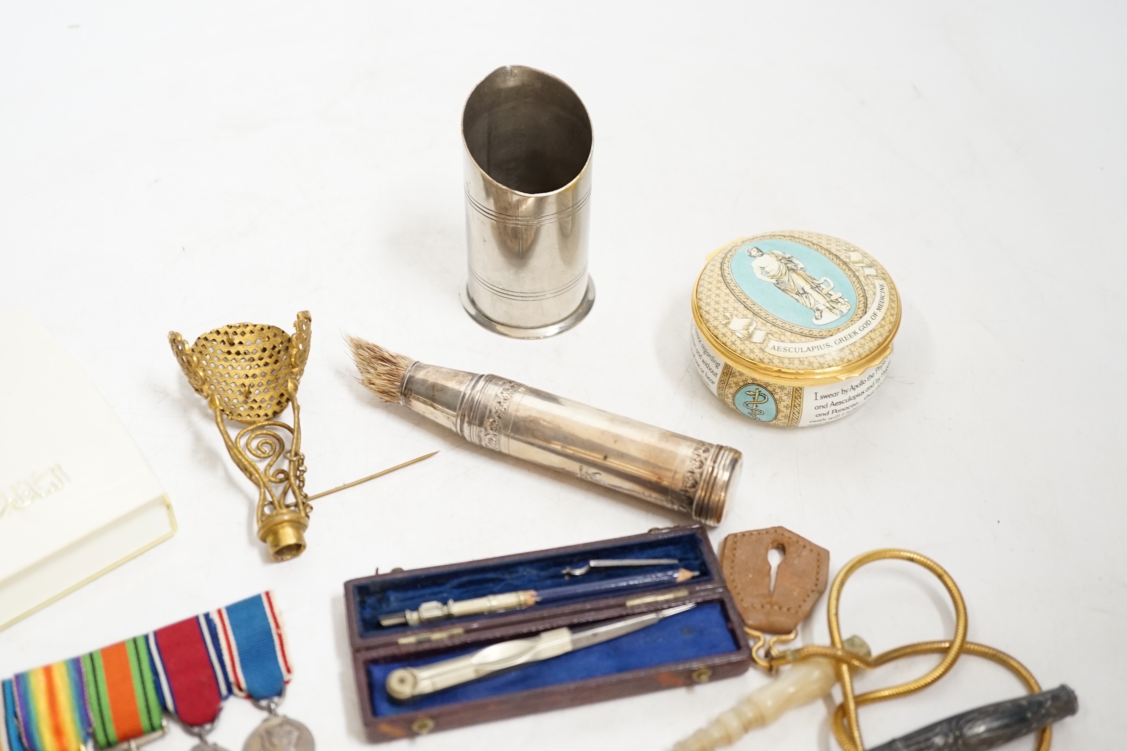 A group of mixed collectables including a gilt metal and turquoise posy holder, silver mounted shaving brush and miniature leather cased drawing set. Condition - varies